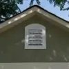 Installed Meridian 8 ft. x 10 ft. Wood Storage Shed with Autumn Brown Shingles
