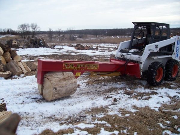 tm_pro_splitting_logs.jpg TM Pro Log Splitter Skid Steer Attachment (24”, 30” or 36” Stroke)